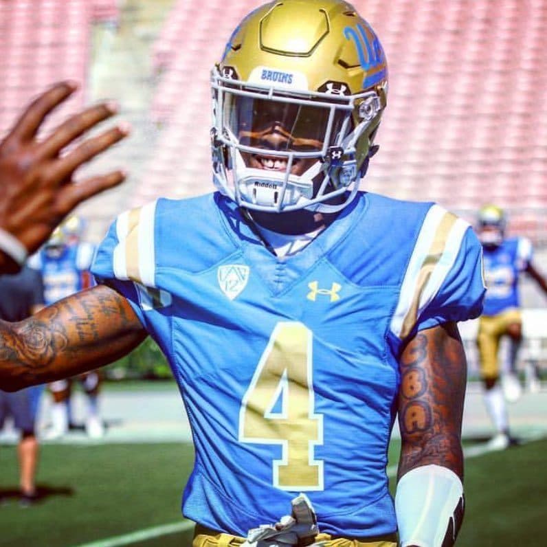 The CBA mark inked on a UCLA defensive back — warmups.